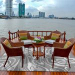 Rattan furniture, table, chairs on river boat