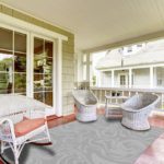 Entrance porch with wicker chairs and glass door